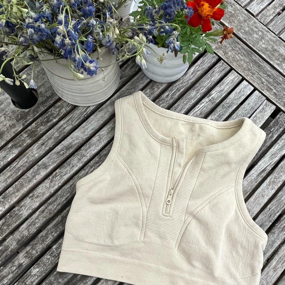 Cream-colored sports bra with a sexy zipper